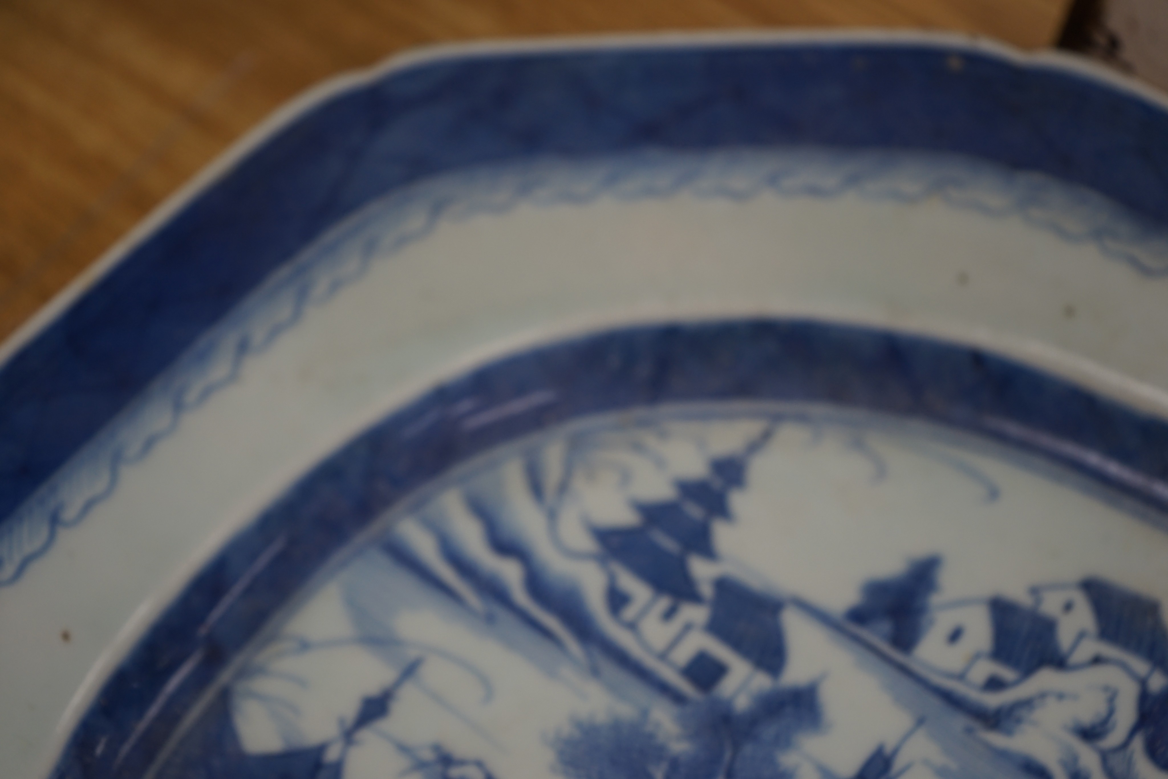 A 19th century Chinese Export blue and white octagonal meat dish, decorated with a lake scene, W 42cm